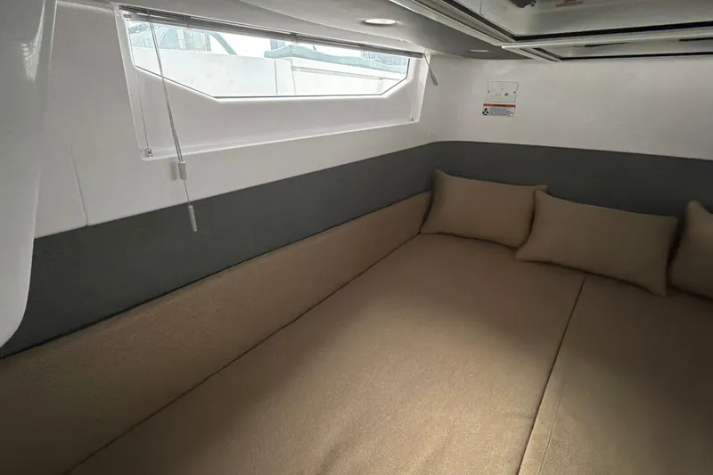 Slide: The Image of Interior cabin of 2022 Axopar Brabus 37 XC Cross Cabin with beige cushions. - 26