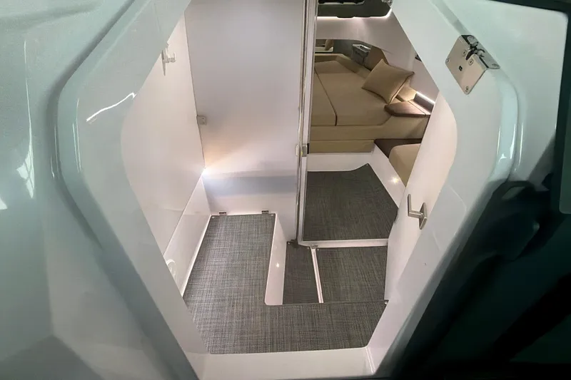 Slide: The Image of Interior view of 2022 Axopar Brabus 37 XC Cross Cabin, featuring modern seating and sleek design. - 27