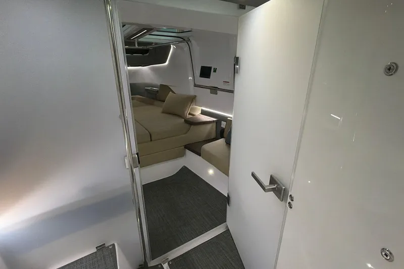 Slide: The Image of Interior of 2022 Axopar Brabus 37 XC Cross Cabin, featuring modern seating and sleek design. - 28