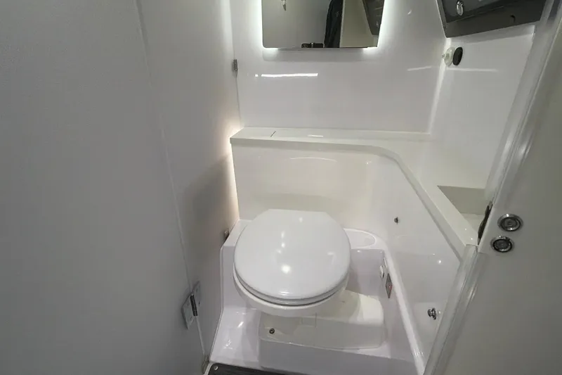 Slide: The Image of 2022 Axopar Brabus 37 XC Cross Cabin bathroom with modern white fixtures. - 29