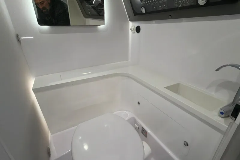 Slide: The Image of Interior of 2022 Axopar Brabus 37 XC Cross Cabin bathroom with modern fixtures. - 30