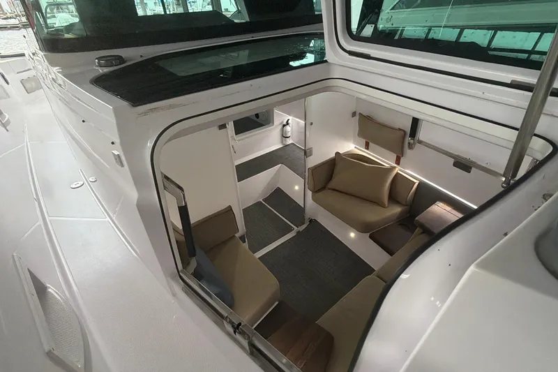 Slide: The Image of Interior view of 2022 Axopar Brabus 37 XC Cross Cabin, featuring cozy seating and modern design. - 37