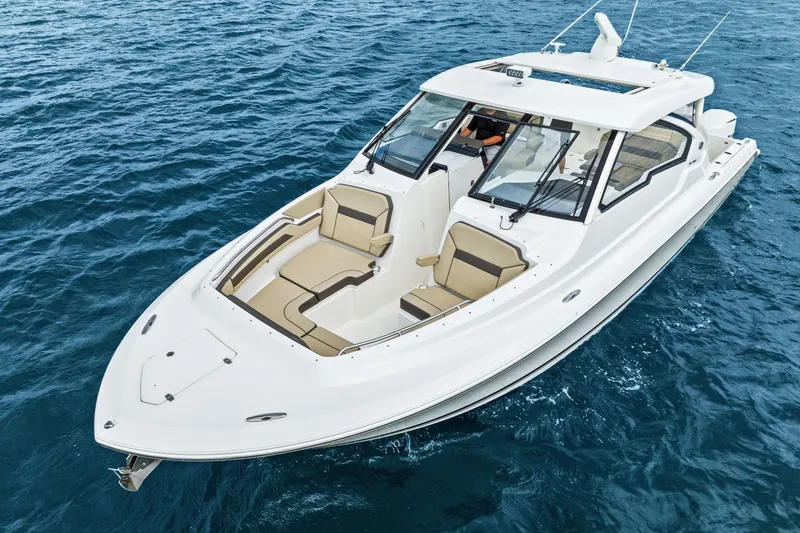 The Image of 2021 Pursuit DC 365 Dual Console on the water. - 0
