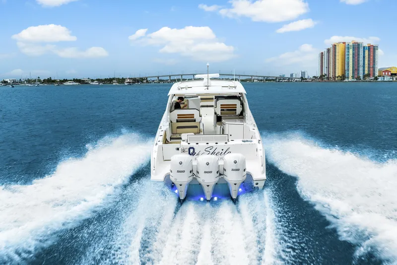 Slide: The Image of Pursuit DC 365 Dual Console 2021 on water, cityscape in background. - 10