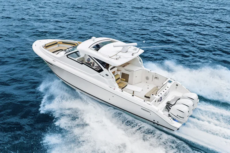 Slide: The Image of Pursuit DC 365 Dual Console 2021 on the ocean. - 16