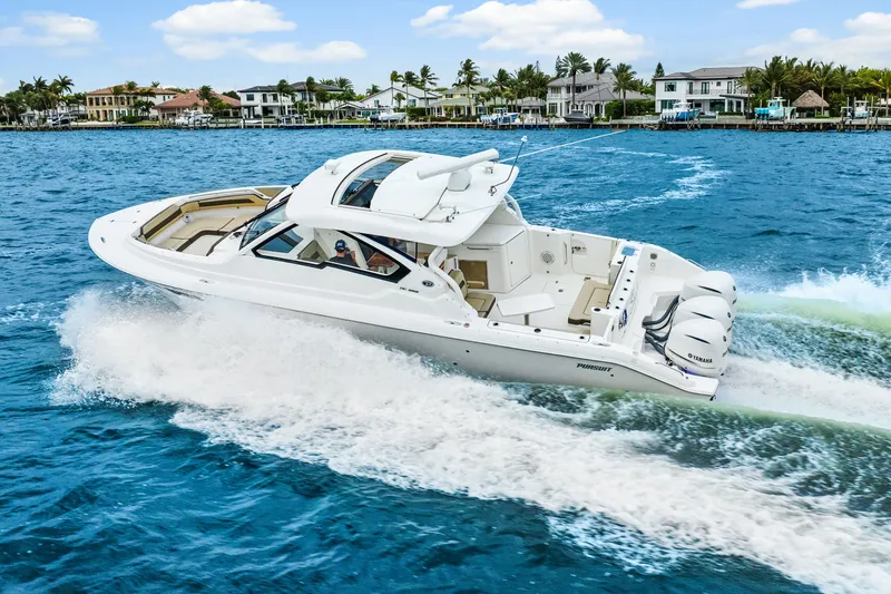 Slide: The Image of Pursuit DC 365 Dual Console 2021 on the water. - 17