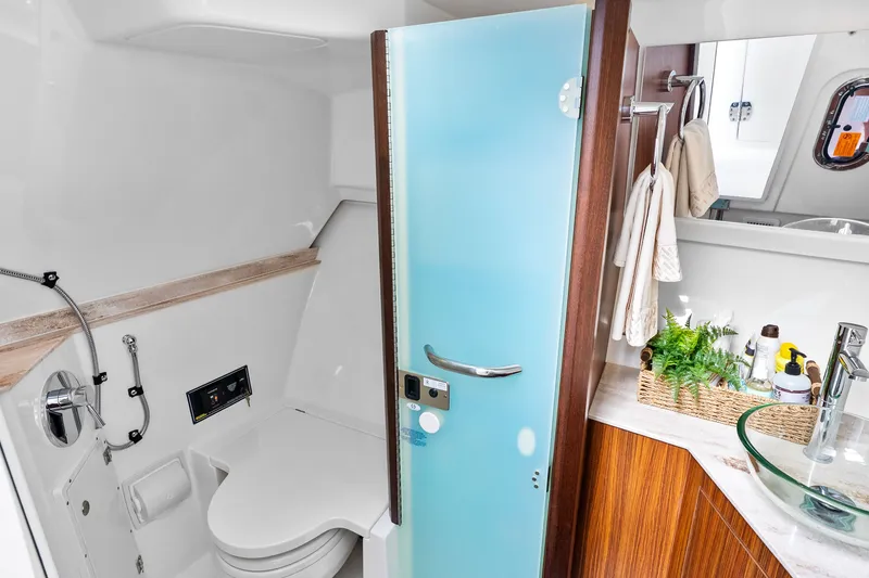 Slide: The Image of Luxurious bathroom on Pursuit DC 365 Dual Console boat, year 2021. - 23