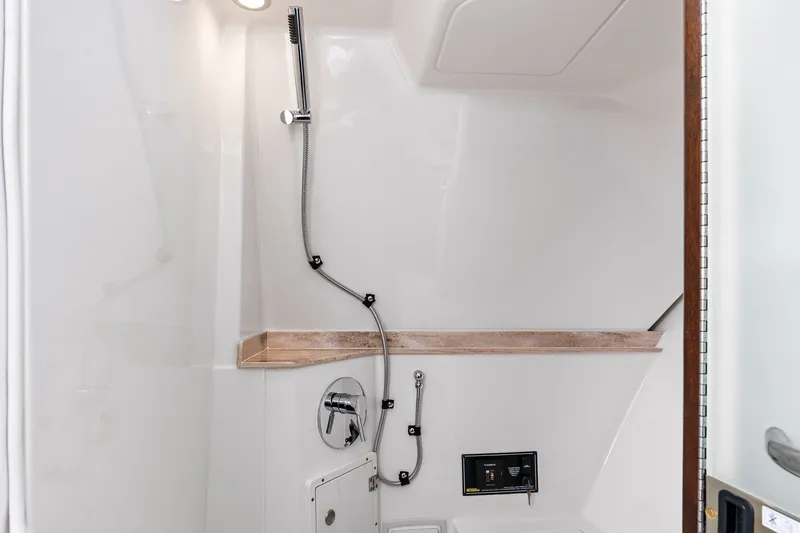 Slide: The Image of Shower in Pursuit DC 365 Dual Console boat, year 2021. - 26