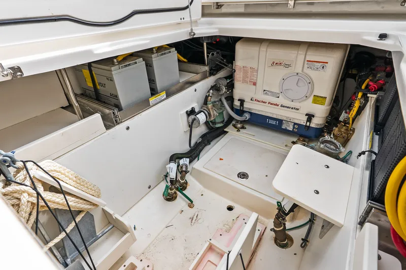 Slide: The Image of Interior of Pursuit DC 365 with generator and batteries. - 32