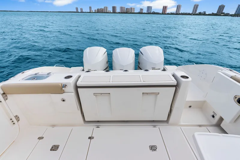 Slide: The Image of Pursuit DC 365 Dual Console boat on water, 2021 model. - 35