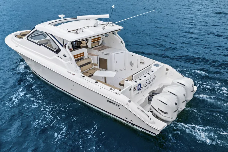 Slide: The Image of Pursuit DC 365 Dual Console 2021 on the water. - 4