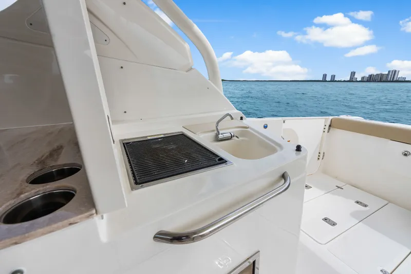 Slide: The Image of Pursuit DC 365 Dual Console 2021 with onboard kitchen and ocean view. - 41