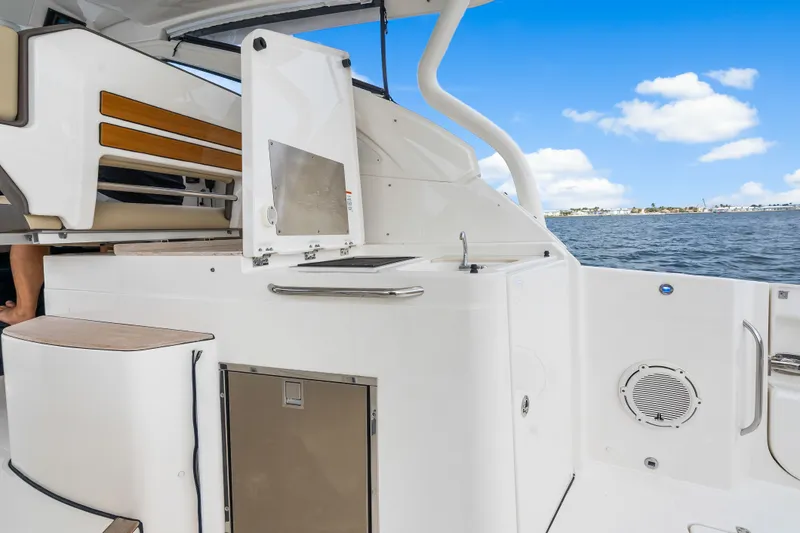 Slide: The Image of Pursuit DC 365 Dual Console boat on water, 2021 model. - 45