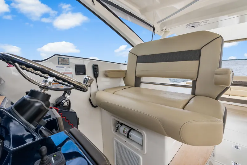 Slide: The Image of Interior of 2021 Pursuit DC 365 Dual Console with helm station. - 49