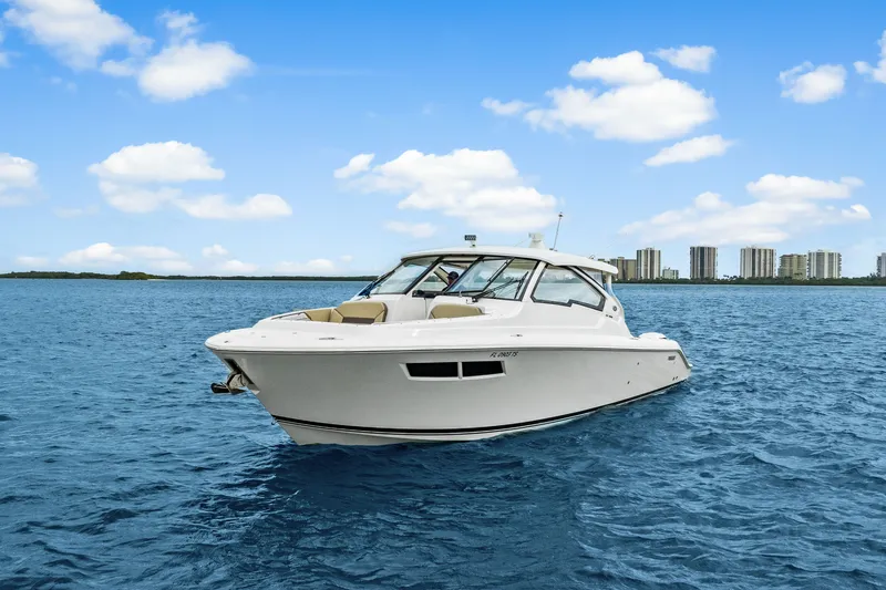 Slide: The Image of Pursuit DC 365 Dual Console 2021 on water with city skyline. - 5