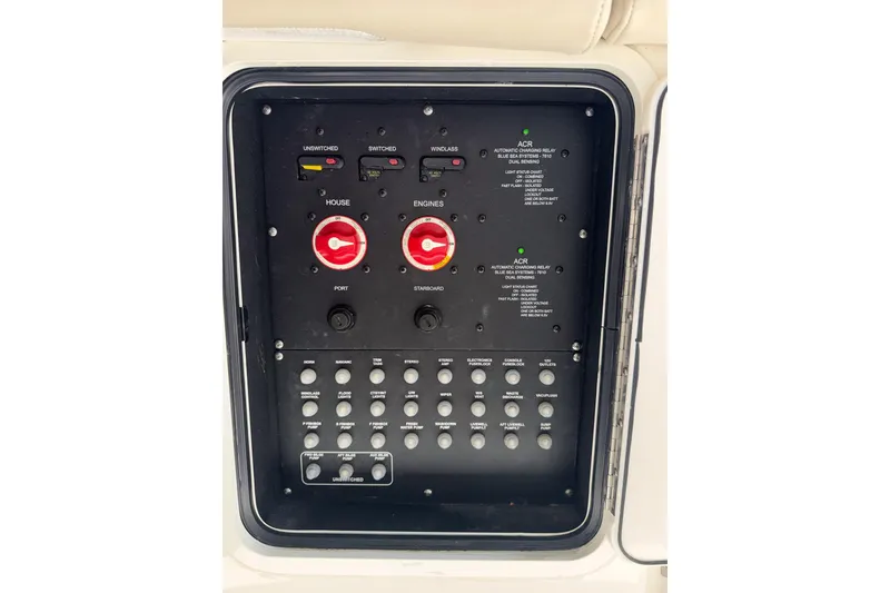 Slide: The Image of Control panel of a 2021 Boston Whaler 330 Outrage boat, featuring switches and dials. - 18
