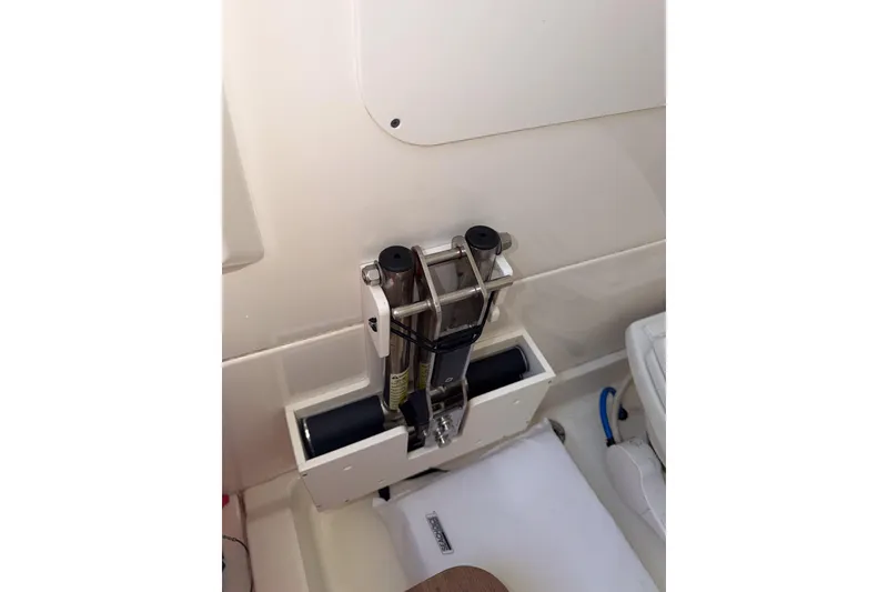 Slide: The Image of Boston Whaler 330 Outrage 2021 boat interior detail with mounted fishing rod holder. - 26