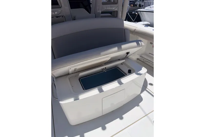 Slide: The Image of 2021 Boston Whaler 330 Outrage boat interior with open storage compartment. - 9