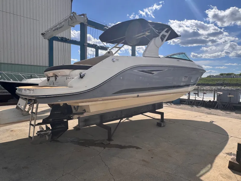 Slide: The Image of 2019 Sea Ray SLX 280 boat on a dry dock. - 18