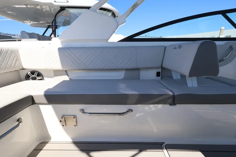 Slide: The Image of Interior of a Sea Ray SDX 270 Outboard with sleek gray upholstery and modern details. - 18
