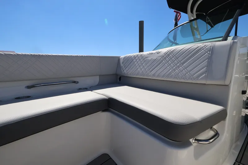 Slide: The Image of The 2027 Sea Ray SDX 270 Outboard features a sleek, cushioned seating area. - 34