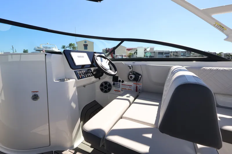 Slide: The Image of Interior view of a Sea Ray SDX 270 Outboard with a modern helm and comfortable seating. - 21