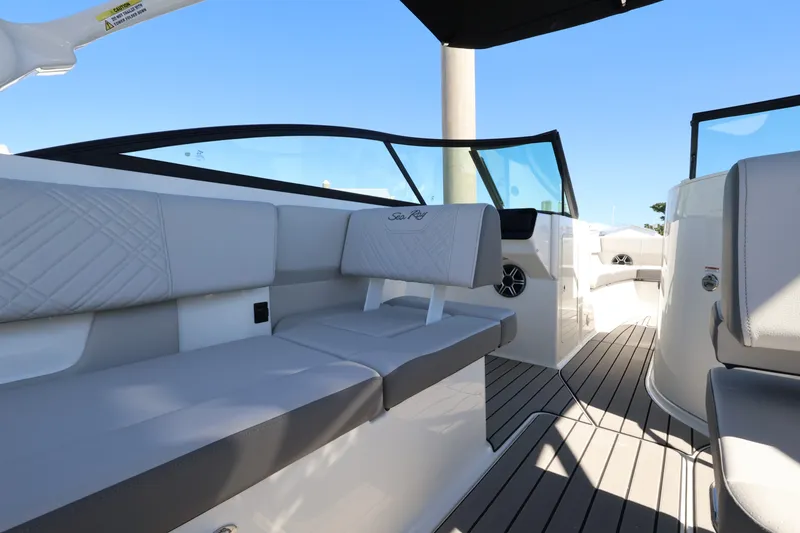 Slide: The Image of The image shows the interior of a Sea Ray SDX 270 Outboard boat with gray seating. - 19