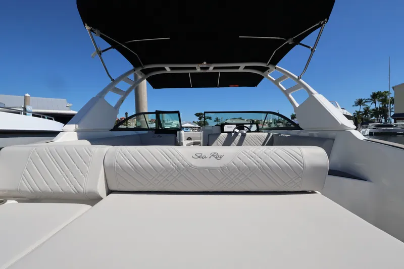 Slide: The Image of The image shows the cockpit of a Sea Ray SDX 270 Outboard with sleek seating and a black sunshade. - 14