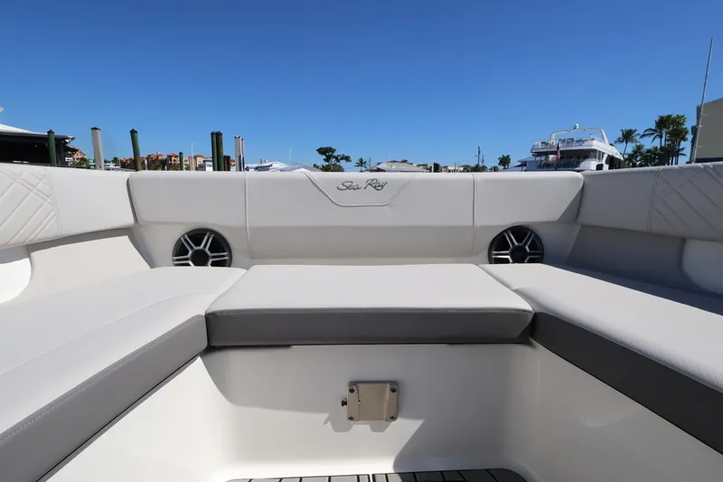 Slide: The Image of The image shows the seating area of a Sea Ray SDX 270 Outboard boat with gray upholstery. - 33