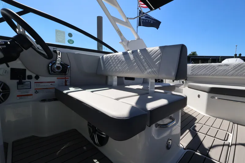 Slide: The Image of The image shows the interior of a Sea Ray SDX 270 Outboard with gray upholstery and modern controls. - 20