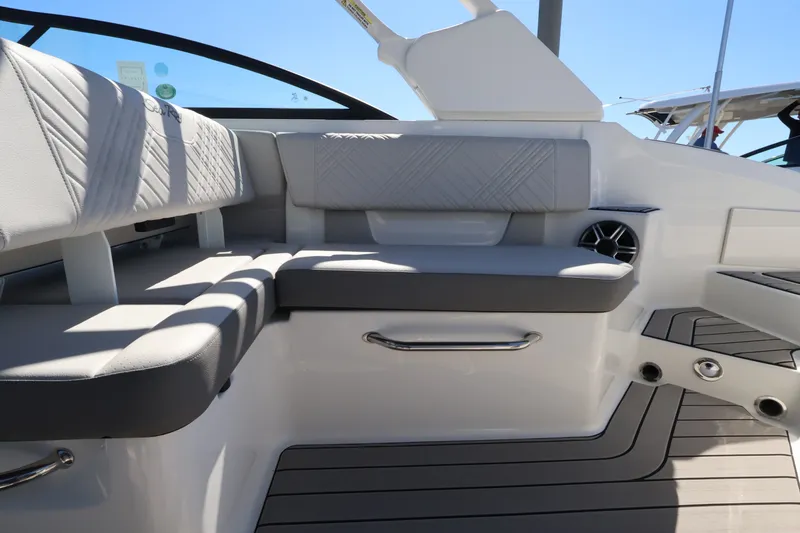 Slide: The Image of Interior of a Sea Ray SDX 270 Outboard with gray upholstery and modern details. - 16