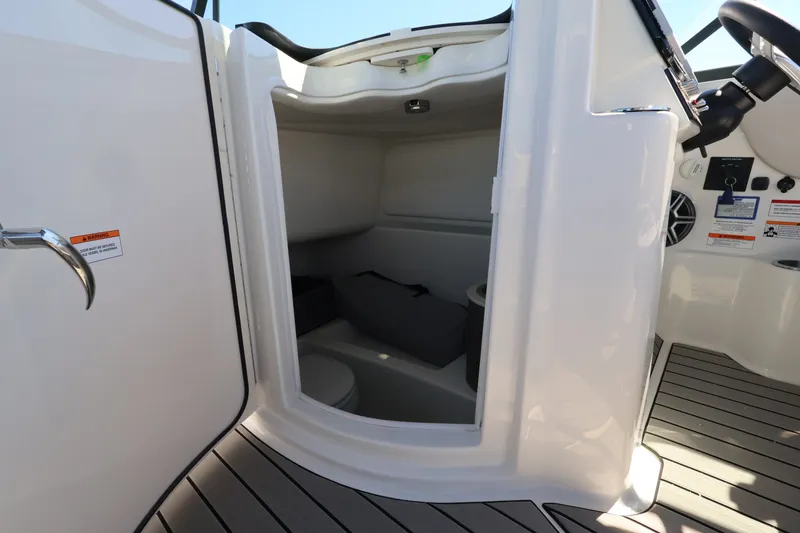 Slide: The Image of Interior of the Sea Ray SDX 270 Outboard with storage and seating area. - 28