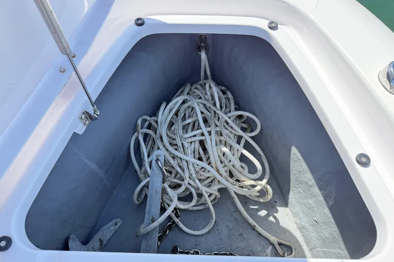 Slide: The Image of Anchor and rope storage in 2022 Axopar 22 T-Top boat compartment. - 20