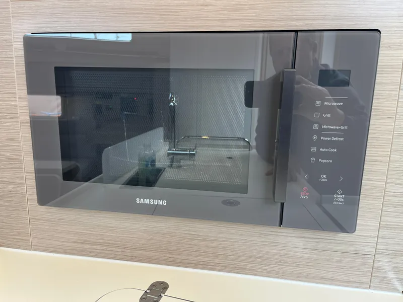 Slide: The Image of Built-in Samsung microwave in a Hanse 418 yacht kitchen, 2021 model. - 17