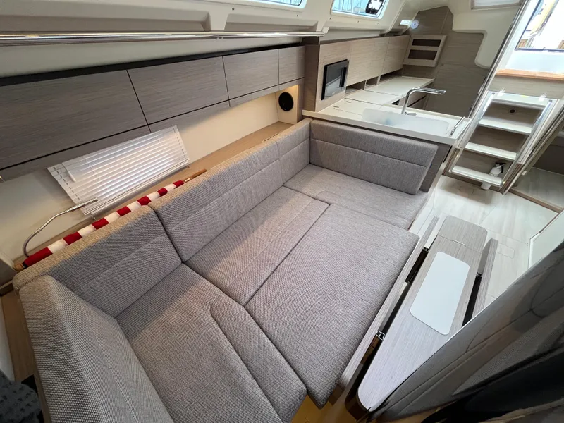 Slide: The Image of Modern interior of 2021 Hanse 418 yacht with sleek gray furnishings and compact kitchen. - 41
