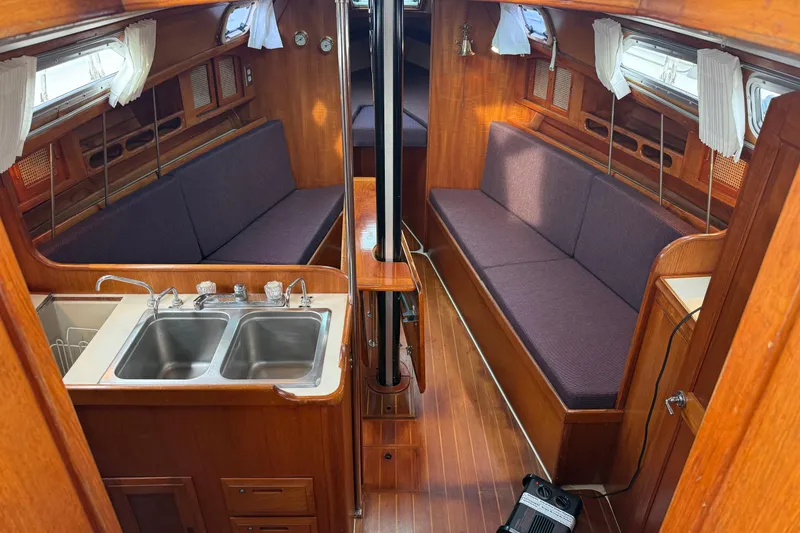 Slide: The Image of Interior of 1988 Ericson 32-200 sailboat with wooden finish and dual sinks. - 20