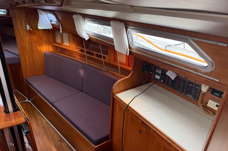 Slide: The Image of Interior of 1988 Ericson 32-200 sailboat with wood finish and navigation station. - 25