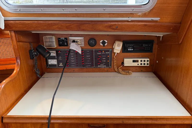Slide: The Image of Control panel of a 1988 Ericson 32-200 sailboat with navigation and communication equipment. - 26