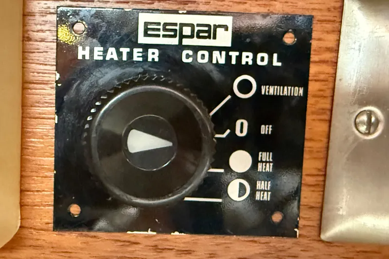 Slide: The Image of Espar heater control panel on 1988 Ericson 32-200 sailboat, featuring ventilation and heat settings. - 28