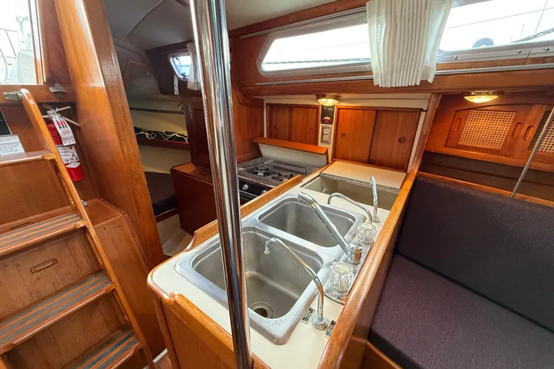 Slide: The Image of Interior of 1988 Ericson 32-200 sailboat with kitchen and seating area. - 31