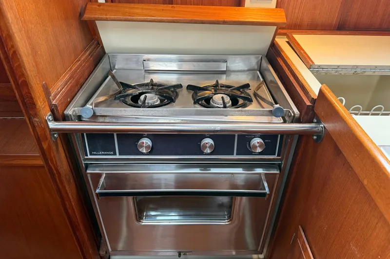 Slide: The Image of Stainless steel stove and oven in 1988 Ericson 32-200 yacht galley. - 34