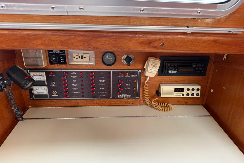 Slide: The Image of Control panel of a 1988 Ericson 32-200 sailboat with gauges and communication devices. - 39