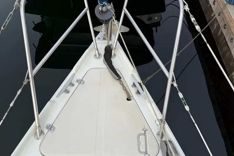 Slide: The Image of Bow of a 1988 Ericson 32-200 sailboat with stainless steel fittings and anchor chain. - 4