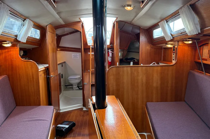 Slide: The Image of Interior of 1988 Ericson 32-200 sailboat with wood finish and cozy seating. - 41