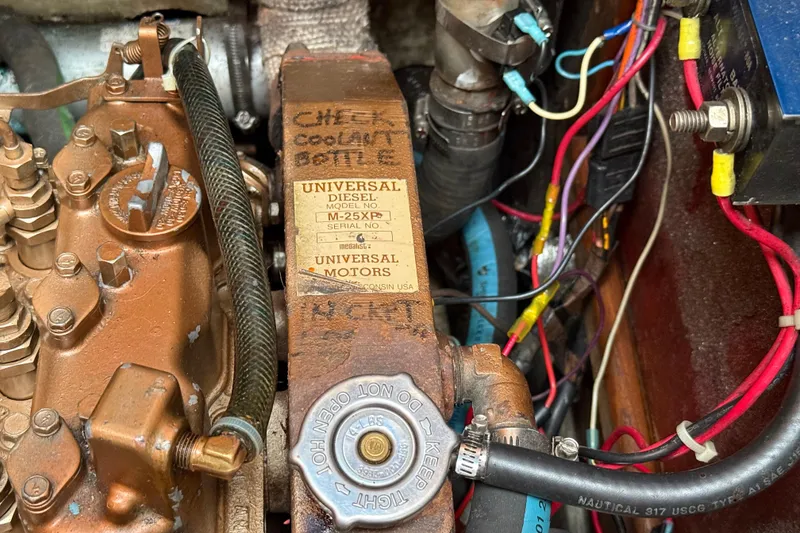 Slide: The Image of Engine compartment of a 1988 Ericson 32-200 sailboat with Universal Diesel engine. - 45