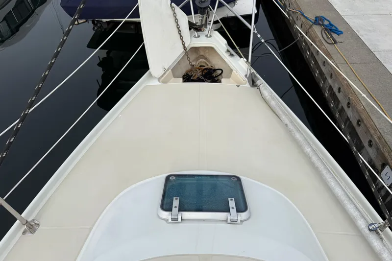 Slide: The Image of Deck view of 1988 Ericson 32-200 sailboat docked at marina. - 5