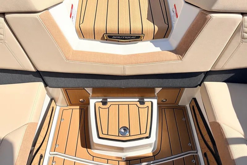 Slide: The Image of 2026 Nautique Super Air Nautique G23 interior with tan and wood accents. - 42