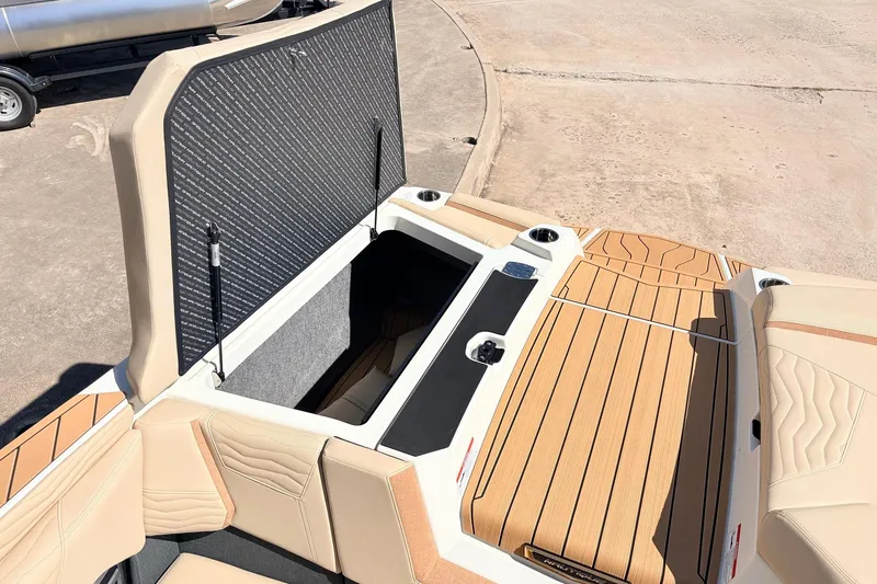 Slide: The Image of 2026 Nautique Super Air Nautique G23 boat interior with open storage compartment. - 61
