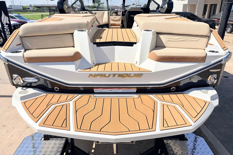 Slide: The Image of 2026 Nautique Super Air Nautique G23 boat with teak deck and cushioned seating. - 71