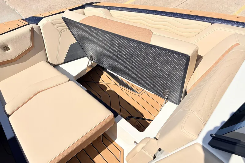 Slide: The Image of 2026 Nautique Super Air Nautique G23 interior with beige seating and sleek design. - 23